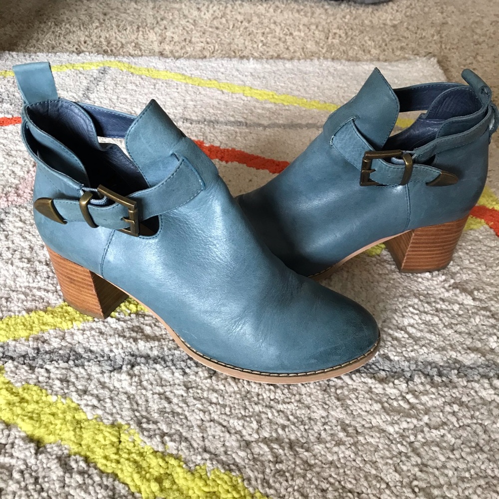 Blue leather boots with brass buckles